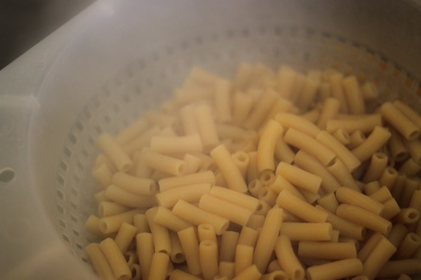 brown rice penne pasta in colander