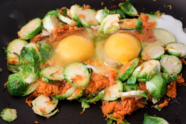 Crack the eggs in the middle of veggies