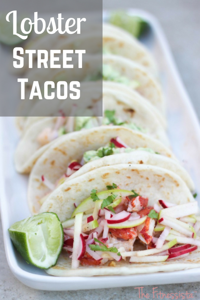 Lobster with butter and garlic is made even more delicious with avocado aioli and apple-radish slaw. You'll crave these lobster street tacos! fitnessista.com #streettacos #lobsterrecipe #lobstertacos