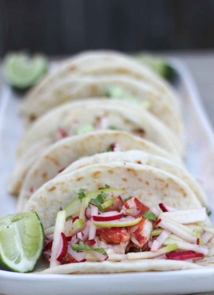 Lobster with butter and garlic is made even more delicious with avocado aioli and apple-radish slaw. You'll crave these lobster street tacos! fitnessista.com