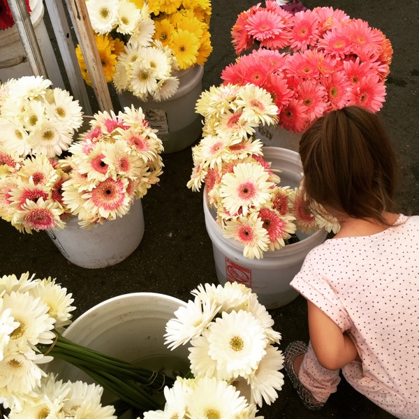 Livi smelling the flowers