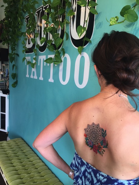 Mandala tattoo with watercolor flowers