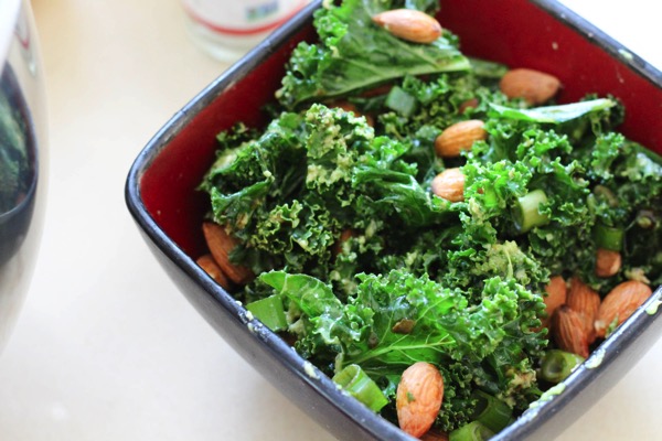 Kale salad with chicken, almonds, avocado