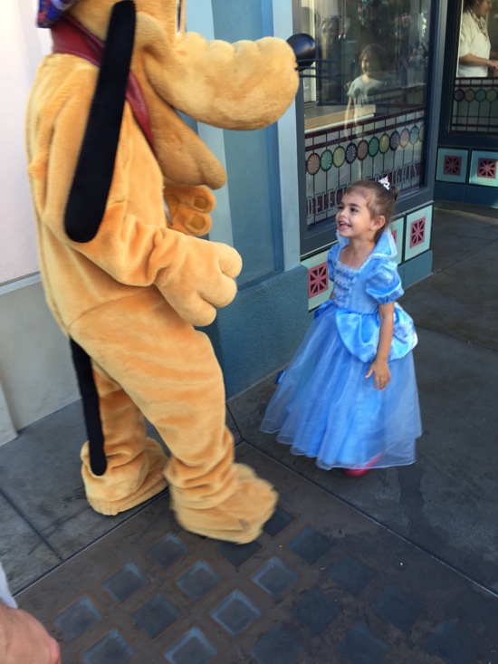 Liv at Disneyland with Pluto