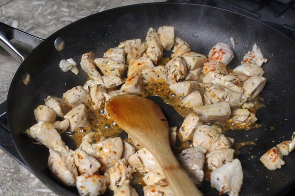 chicken cooking on the stove