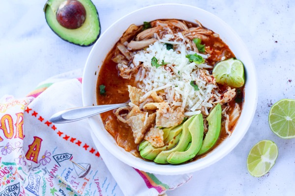 Chicken tortilla soup in the Instant Pot only using 6 ingredients. Gluten-free, packed with protein, and the whole family will love it. Fitnessista.com