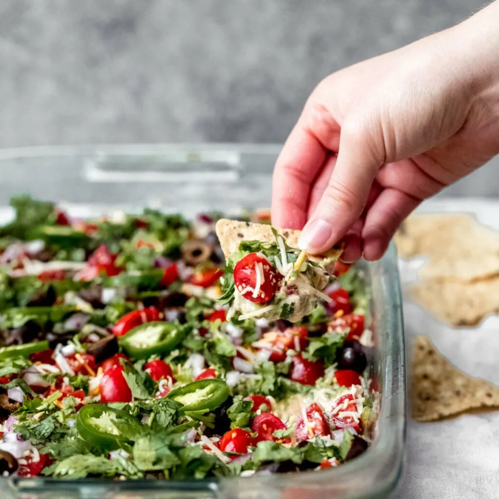 Fresh and Healthy 7-Layer Dip via Ambitious Kitchen