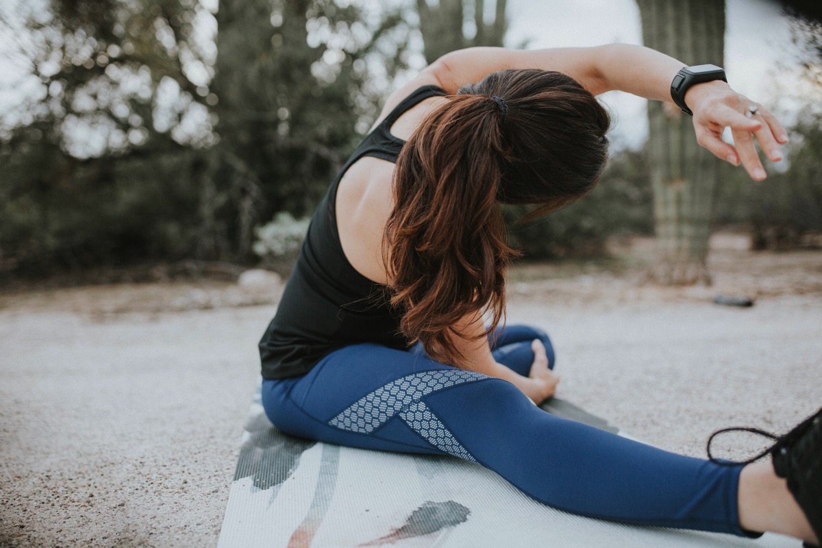 Stretching in GapFit by Gap Factory reflective leggings